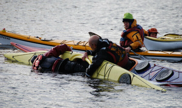 kayaks collapsing on side